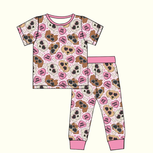 Children's pajama set with dog pattern on a white background